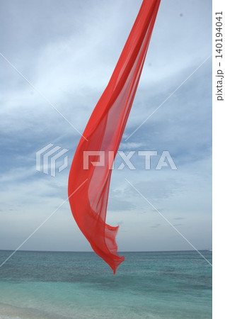 Red Color Cloth Flying In Wind 140194041