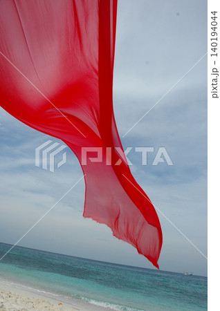 Red Color Cloth Flying In Wind 140194044