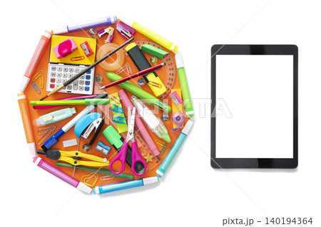 E-learning online learning with tablet PC and school supplies on white E-learning online learning with tablet PC and school supplies on white 140194364