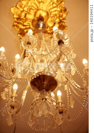Old electric chandelier lamp 140194411