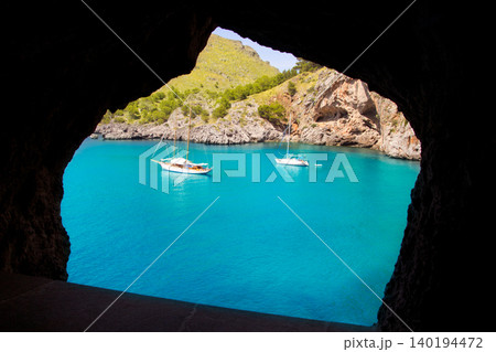 Escorca Sacalobra beach view from cave window Escorca Sacalobra beach view from cave window 140194472