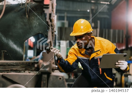 Professional African black engineer male technician expert worker control operate machine in plant Professional African black engineer male technician expert worker control operate machine in plant 140194537
