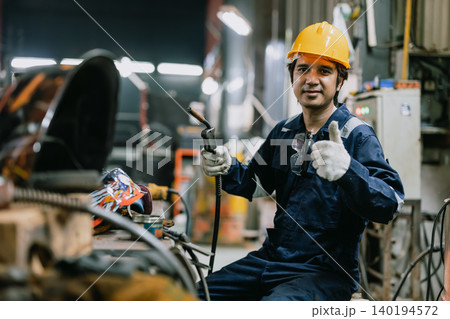 Portrait professional Asian male welder worker working metal factory looking camera in safety 140194572