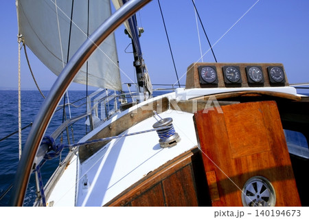 Sailing with an old sailboat over mediterranean sea Sailing with an old sailboat over mediterranean sea 140194673