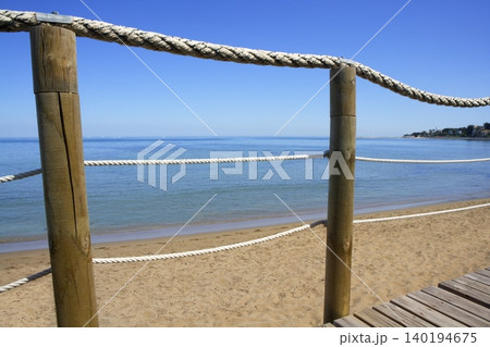 catwalk on wood rope railing on sea beach 140194675