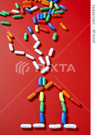 colorful candy on vivid red background colorful candy on vivid red background 140194843