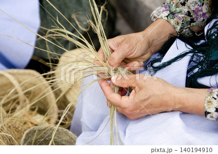 esparto woman hands handcrafts Mediterranean esparto woman hands handcrafts Mediterranean 140194910