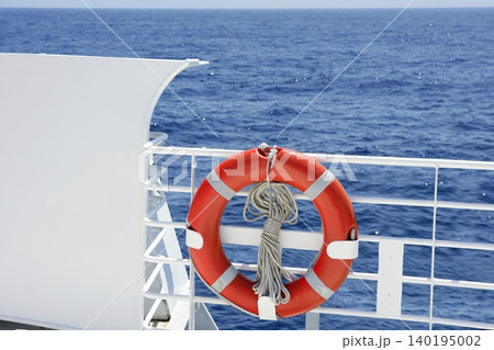 Cruise white boat handrail detail in blue sea Cruise white boat handrail detail in blue sea 140195002