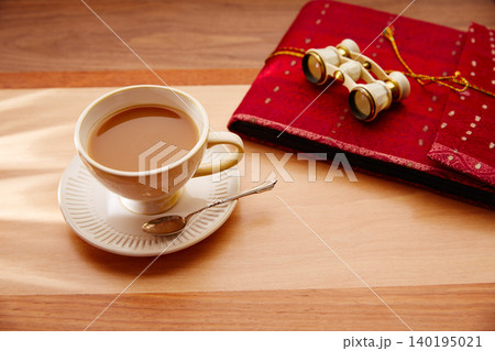 Traveler coffee or milk tea with binoculars and notebook Traveler coffee or milk tea with binoculars and notebook 140195021