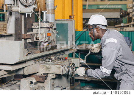 Engineer technician worker using Surface Grinding machine working in heavy metal industry Engineer technician worker using Surface Grinding machine working in heavy metal industry 140195092