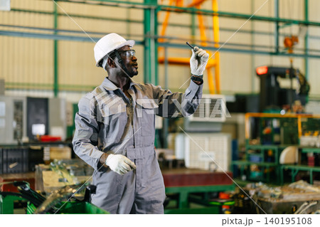 African Black male worker working check quality of metal part production in heavy industry factory African Black male worker working check quality of metal part production in heavy industry factory 140195108