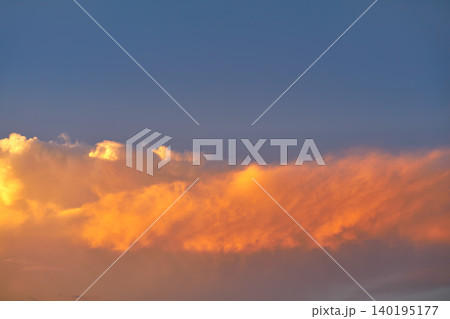 Sunset sky orange clouds on blue Sunset sky orange clouds on blue 140195177