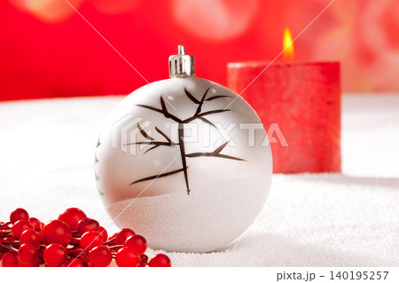 Christmas card of tree bauble and red candle 140195257