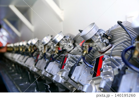 Engines from kart cars in row line for been inspected Engines from kart cars in row line for been inspected 140195260