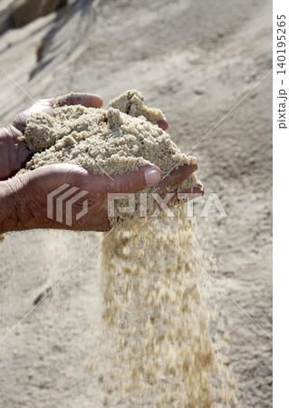 gravel sand in man hands in quarry showing camera gravel sand in man hands in quarry showing camera 140195265