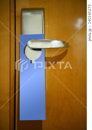 Hotel door handle with a copy space note Hotel door handle with a copy space note 140195273