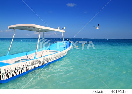 blue boat seagulls Caribbean turquoise sea 140195332