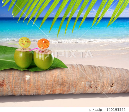 coconut cocktail in turquoise Caribbean beach coconut cocktail in turquoise Caribbean beach 140195333