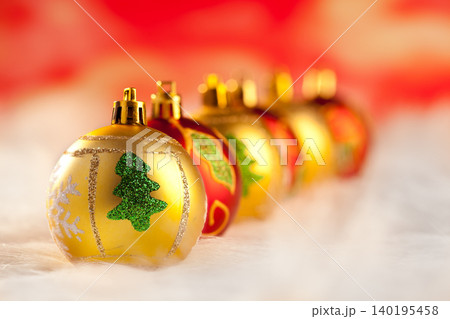 christmas golden red baubles in a row with lights 140195458