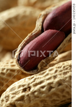 Peanuts macro over wood background Peanuts macro over wood background 140195459