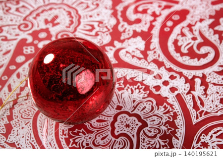 Chrsitmas red ball over indian pattern Chrsitmas red ball over indian pattern 140195621