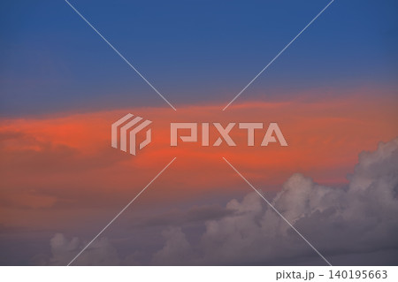 Sunset sky orange clouds on blue Sunset sky orange clouds on blue 140195663