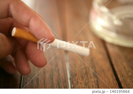 before lighting the cigarette before lighting the cigarette 140195668
