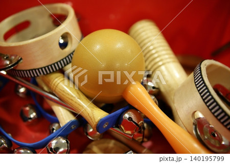 mixed percussion toy instruments on red mixed percussion toy instruments on red 140195799
