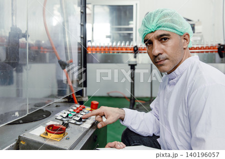 Factory engineer technician working machine operate setting in food and drink factory with hygiene Factory engineer technician working machine operate setting in food and drink factory with hygiene 140196057