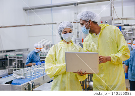 Food hygiene inspector team work examination food production process in line at cannery food factory Food hygiene inspector team work examination food production process in line at cannery food factory 140196082