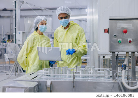 Food hygiene inspector team work examination food production process in line at cannery food factory Food hygiene inspector team work examination food production process in line at cannery food factory 140196093