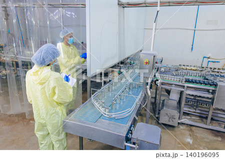 Food hygiene inspector team work examination food production process in line at cannery food factory Food hygiene inspector team work examination food production process in line at cannery food factory 140196095