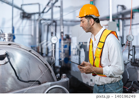 Industrial factory worker, Engineer staff working in plant factory, Check service boiler water plumbing pipe system. 140196249