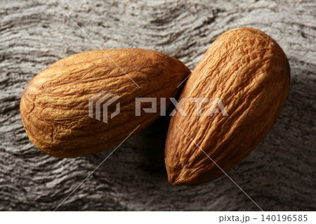 Almond macro over wood background Almond macro over wood background 140196585