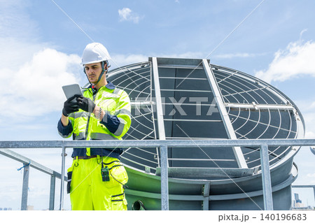 Professional Worker Servicing HVAC building cooling tower, Industry air conditioner service Professional Worker Servicing HVAC building cooling tower, Industry air conditioner service 140196683