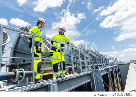 Professional Worker Teamwork Servicing HVAC building cooling tower, Industry air conditioner service 140196690