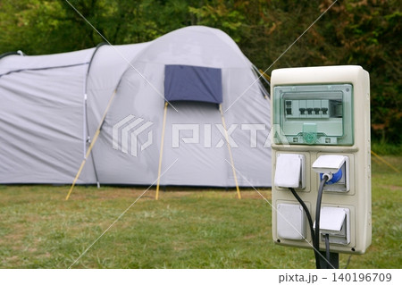 Electric camping plug box detail with tent 140196709