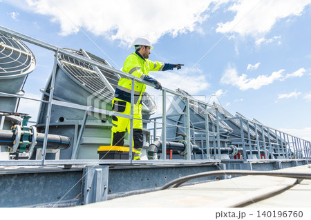 Professional Worker Servicing HVAC building cooling tower, Industry air conditioner service Professional Worker Servicing HVAC building cooling tower, Industry air conditioner service 140196760
