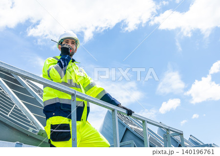 Professional Worker Servicing HVAC building cooling tower, Industry air conditioner service 140196761