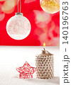 christmas silver candle and red star on snow 140196763