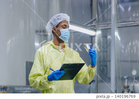Food cannery industry hygiene worker check tin can for food product container, Canned food factory Food cannery industry hygiene worker check tin can for food product container, Canned food factory 140196769