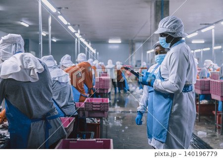 Food hygiene officer inspecting and certifying the cleanliness of fish production product factory, Food hygiene officer inspecting and certifying the cleanliness of fish production product factory, 140196779