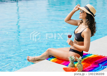 Beauty woman happy relax at swimming pool summer holiday travel vacation. Girl at luxury resort 140196899