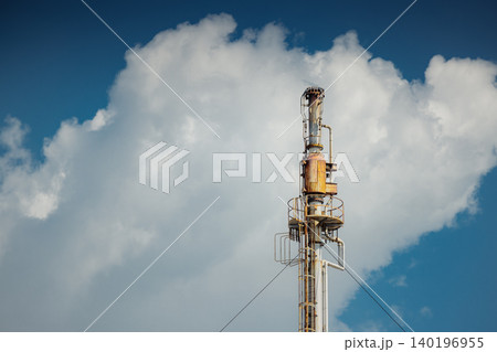 Methane Gas Fire High Flare Stack Flaring Tower Platform in Refinery Petroleum Plant or Flame Burn Methane Gas Fire High Flare Stack Flaring Tower Platform in Refinery Petroleum Plant or Flame Burn 140196955