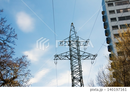 Electric transmission tower against blue sky Electric transmission tower against blue sky 140197161