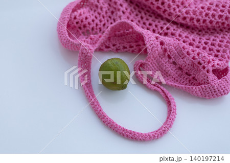 Green Lime and Pink Crochet Mesh Bag on White Surface 140197214