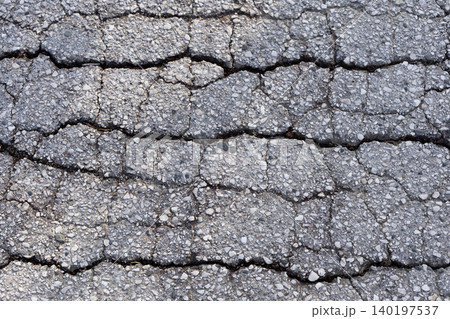 Cracked Asphalt Texture with Deep Crevices Cracked Asphalt Texture with Deep Crevices 140197537