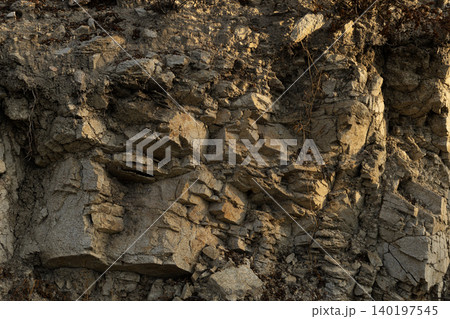 Rocky Cliff Face with Cragged Stone Texture 140197545