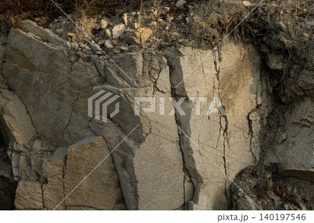 Cracked Stone Wall with Layered Rock Formation Cracked Stone Wall with Layered Rock Formation 140197546