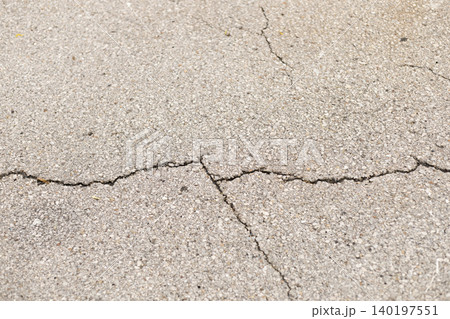 Cracked Asphalt Texture with Damaged Pavement Cracked Asphalt Texture with Damaged Pavement 140197551
